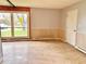 Bright living area with neutral walls and a large picture window at 1221 S Catherwood Ave, Indianapolis, IN 46203