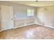 Neutral living room features classic wainscoting and a bright window at 1221 S Catherwood Ave, Indianapolis, IN 46203