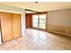 Bright living area with double closet, neutral walls and a picture window at 1221 S Catherwood Ave, Indianapolis, IN 46203