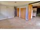 A cozy living area with wood-look floors connects to a kitchen and has a double closet at 1221 S Catherwood Ave, Indianapolis, IN 46203