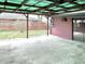 View of the covered patio with access to the house and an open view of the backyard at 1221 S Catherwood Ave, Indianapolis, IN 46203