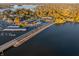 Scenic aerial view of the lake and harbor, showcasing boats, restaurants, and a vibrant waterfront community at 12372 Ostara Ct, Fishers, IN 46037