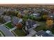 Aerial view of the neighborhood featuring large homes, lush landscaping, mature trees, and well-manicured lawns at 12372 Ostara Ct, Fishers, IN 46037