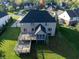 Aerial view of the home showing the large back deck and manicured lawn at 12372 Ostara Ct, Fishers, IN 46037
