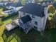 Aerial view of the brick and vinyl siding home showing the large deck and screened-in porch overlooking the backyard at 12372 Ostara Ct, Fishers, IN 46037