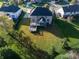 Aerial view of the home's spacious backyard featuring a deck, screened-in porch, and lush green lawn at 12372 Ostara Ct, Fishers, IN 46037