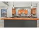 Bar area with cabinets, countertop seating, recessed lighting, and decorative hanging lights at 12372 Ostara Ct, Fishers, IN 46037