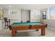 Finished basement with a pool table, neutral walls, and large windows at 12372 Ostara Ct, Fishers, IN 46037