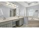 Bright primary bathroom with double vanity sinks, soaking tub, and tiled flooring at 12372 Ostara Ct, Fishers, IN 46037