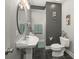 Bathroom with vessel sink, black floor tiles, walk-in shower, and neutral paint at 12372 Ostara Ct, Fishers, IN 46037