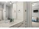 Bathroom featuring a spacious vanity with a large mirror and direct access to the bedroom at 12372 Ostara Ct, Fishers, IN 46037
