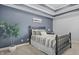 Comfortable bedroom featuring a decorative ceiling, calm color palette, and a cozy bed at 12372 Ostara Ct, Fishers, IN 46037