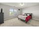 Bedroom with a queen-size bed, ceiling fan, and a window with natural light at 12372 Ostara Ct, Fishers, IN 46037