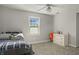 Bedroom featuring a comfortable bed, window with natural light, and dresser for optimal storage at 12372 Ostara Ct, Fishers, IN 46037