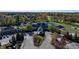 Aerial view of the stylish Heather Pointe clubhouse with surrounding trees and landscaping at 12372 Ostara Ct, Fishers, IN 46037