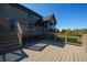 Multi-level deck with multiple seating areas and stairs to the yard at 12372 Ostara Ct, Fishers, IN 46037