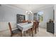 Dining room with wainscoting, decorative lighting, and a large window at 12372 Ostara Ct, Fishers, IN 46037