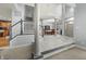 Spacious entryway with staircase, columns, access to dining room and kitchen at 12372 Ostara Ct, Fishers, IN 46037