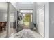 Bright entryway featuring an open door, neutral walls, tiled floors, and view of front yard at 12372 Ostara Ct, Fishers, IN 46037