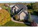 Charming brick home with a well-manicured lawn, mature trees, and a welcoming facade at 12372 Ostara Ct, Fishers, IN 46037