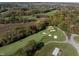 Scenic aerial of Heather Pointe's golf course with lush greens and sand traps at 12372 Ostara Ct, Fishers, IN 46037