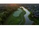 Beautiful aerial view of the golf course featuring well-manicured greens, water features, and lush surroundings at 12372 Ostara Ct, Fishers, IN 46037