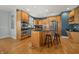 Modern kitchen with stainless steel appliances, wooden cabinets, and an island at 12372 Ostara Ct, Fishers, IN 46037