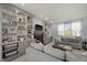 Inviting living room with built-in shelving, fireplace, and comfortable seating at 12372 Ostara Ct, Fishers, IN 46037