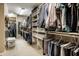 Spacious walk-in closet with custom shelving, ample hanging space, and organized storage solutions for clothing and accessories at 12715 Norfolk Ln, Carmel, IN 46032