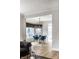 The view is of an elegant dining area with stylish chandelier and custom window treatments at 12715 Norfolk Ln, Carmel, IN 46032