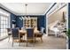 Stylish dining room with a grand piano visible, offering a unique space for both dining and entertainment at 12715 Norfolk Ln, Carmel, IN 46032