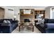 Charming living room featuring a brick fireplace, built-in shelving, and comfortable sofas at 12715 Norfolk Ln, Carmel, IN 46032