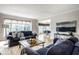 An inviting living room features comfortable sofas and an open view of the dining area at 12715 Norfolk Ln, Carmel, IN 46032