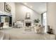 Bright living room with vaulted ceilings, a grand piano, fireplace, and comfortable seating creating an inviting space at 12715 Norfolk Ln, Carmel, IN 46032