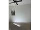 Unfinished bedroom with new ceiling fan and a view of the window at 1309 W Memorial Dr, Muncie, IN 47302