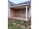 View of the covered front porch with concrete flooring and exterior siding at 1309 W Memorial Dr, Muncie, IN 47302