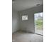 Room featuring a back door and new window at 1309 W Memorial Dr, Muncie, IN 47302