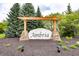 Community entrance sign 'Ambria' with manicured landscaping and accent lighting at 14014 Fieldcrest Dr, McCordsville, IN 46055