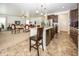 Modern kitchen with stainless steel appliances, granite countertops, and view of the living room at 14014 Fieldcrest Dr, McCordsville, IN 46055