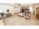 Well-lit living room open to the kitchen, perfect for entertaining and relaxation at 14014 Fieldcrest Dr, McCordsville, IN 46055