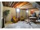 Spacious basement featuring exposed ceiling, sitting area, and Christmas tree at 1611 Connemara Rd, Indianapolis, IN 46217