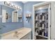 Modern bathroom with a single sink vanity and shower-tub combo at 1611 Connemara Rd, Indianapolis, IN 46217