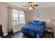Cozy bedroom showcasing a comfortable bed, nightstands and large window with view at 1611 Connemara Rd, Indianapolis, IN 46217