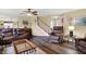 Spacious living room with hardwood floors, leather furniture, and an inviting atmosphere at 1611 Connemara Rd, Indianapolis, IN 46217