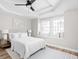 Bright main bedroom featuring recessed lighting, wood flooring, and a large window seat with ample natural light at 1613 E Ohio St, Indianapolis, IN 46201