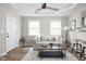 Bright living room featuring modern decor, wood flooring, recessed lighting, and plenty of natural light at 1613 E Ohio St, Indianapolis, IN 46201