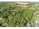 Lush aerial view of a property with mature trees and landscaping; beautiful setting at 16632 Oak Rd, Westfield, IN 46074