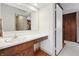 Functional bathroom vanity with wood cabinets and a clean, well-lit mirror, enhancing everyday convenience at 16632 Oak Rd, Westfield, IN 46074