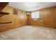 This bedroom features warm wood paneled walls, and shelving for displaying items at 16632 Oak Rd, Westfield, IN 46074
