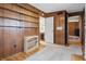 This bedroom features warm wood paneled walls, built in shelving, and access to an adjacent bathroom at 16632 Oak Rd, Westfield, IN 46074